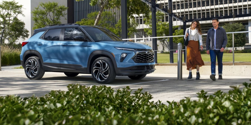 Couple walking to new car they bought.